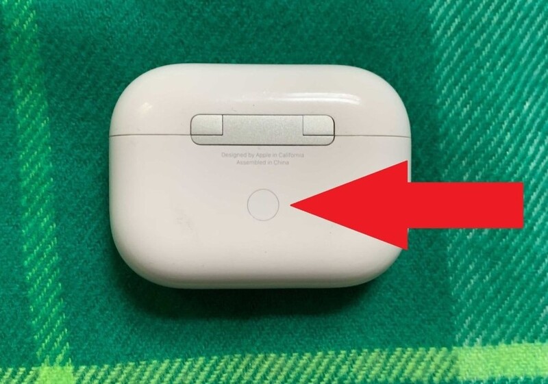 Press and hold the small round button on the back of the box